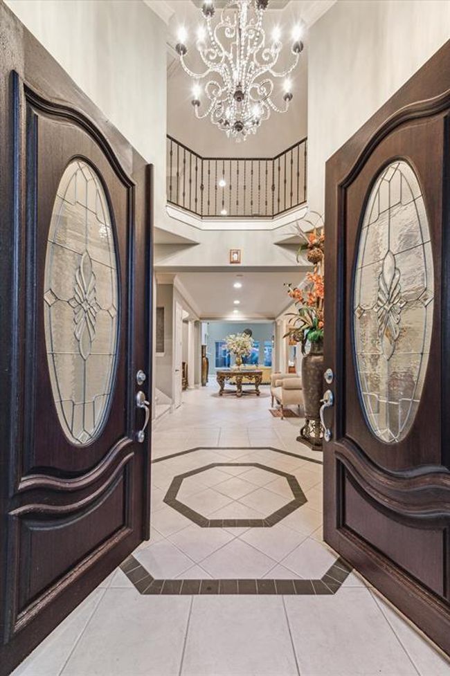 Guests enter the home, built by Taylor Woodrow, through upgraded double doors and are immediately enveloped in custom details. | Image 5