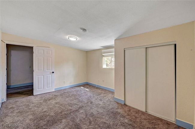 Unfurnished bedroom featuring carpet, a closet, and a textured ceiling | Image 34