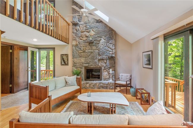 Breathtaking family room, floor to ceiling stone gas fireplace. Hardwood floors | Image 20