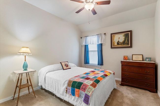 Secondary bedroom #2 has ceiling fan light. | Image 24