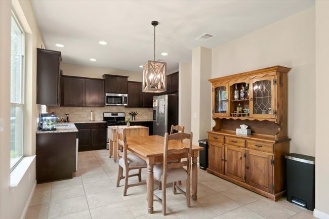 Breakfast area connected to eat-in kitchen. | Image 7