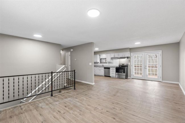 Unfurnished living room with baseboards, light wood-style flooring, and recessed lighting | Image 6