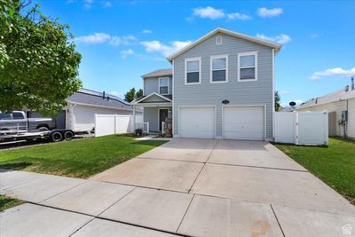 View of front of property featuring a garage and a front lawn | Image 2