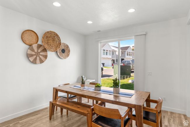 Dining room with recessed lighting, light wood-type flooring, baseboards, and visible vents | Image 9