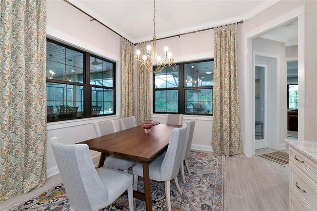 Dining Room with views of Lanai and Pool | Image 18