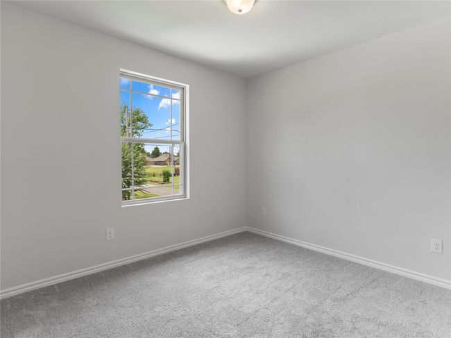 Upstairs third bedroom featuring cozy carpeting. | Image 13