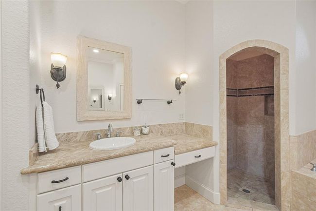 Dual-sink vanity with dedicated makeup area. | Image 27