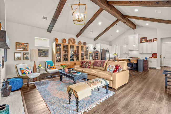 Specious living room with vaulted ceilings and exposed wood beams | Image 4