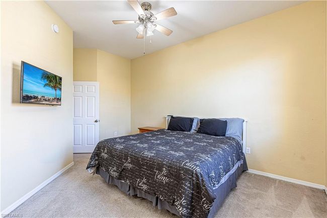 Bedroom featuring baseboards, ceiling fan, and carpet | Image 14