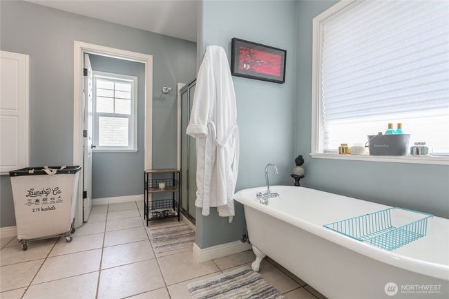 Primary suite includes clawfoot tub and shower with walk in closet | Image 22