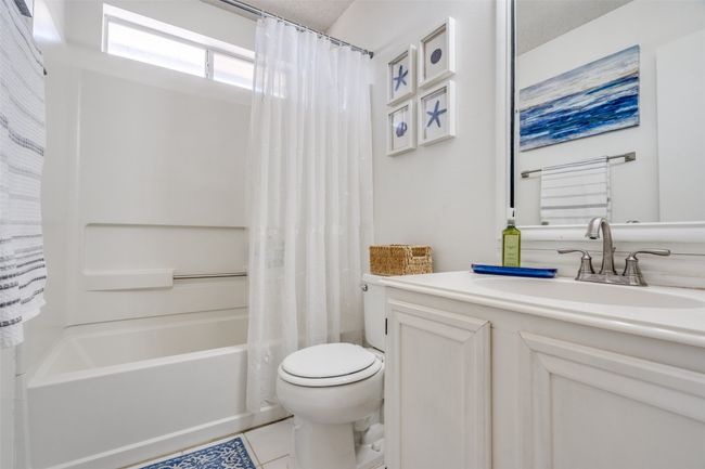 The guest bath is conveniently located between the two secondary bedrooms. | Image 21