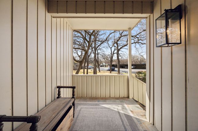 Font door personal patio area over looking front green space, exterior closet storage behind, front door to the right. | Image 5