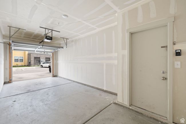 Garage featuring a garage door opener | Image 23
