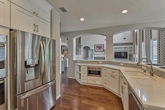 Under the counter microwave. Stainless Steel appliances. Sink position allows for the conversation to continue while cleaning dishes. | Image 20