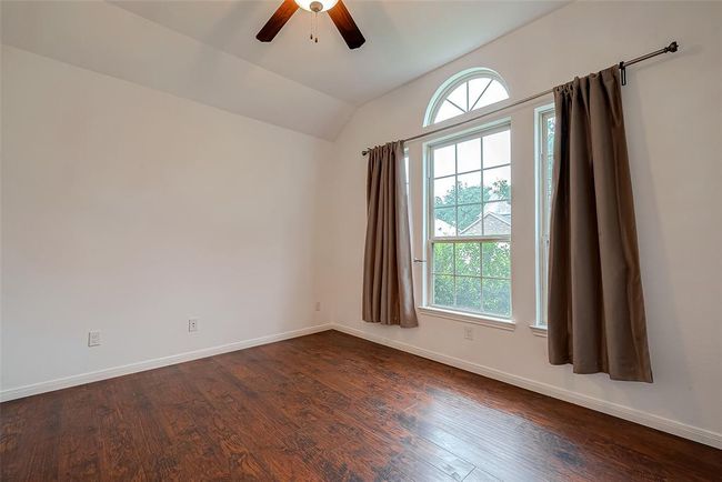 4th bedroom or home office features high ceilngs and large picture window | Image 29
