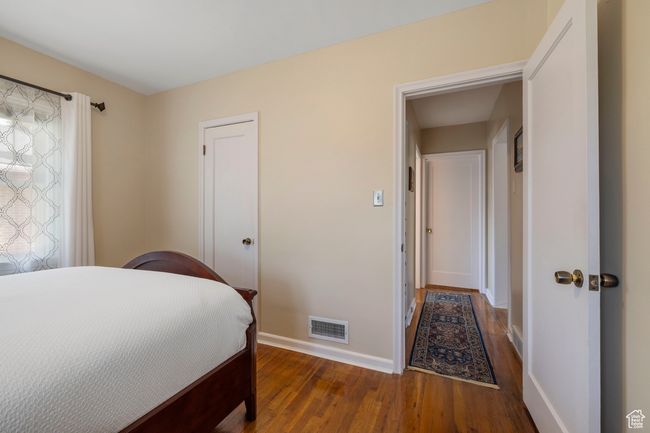 Bedroom featuring baseboards and wood finished floors | Image 13