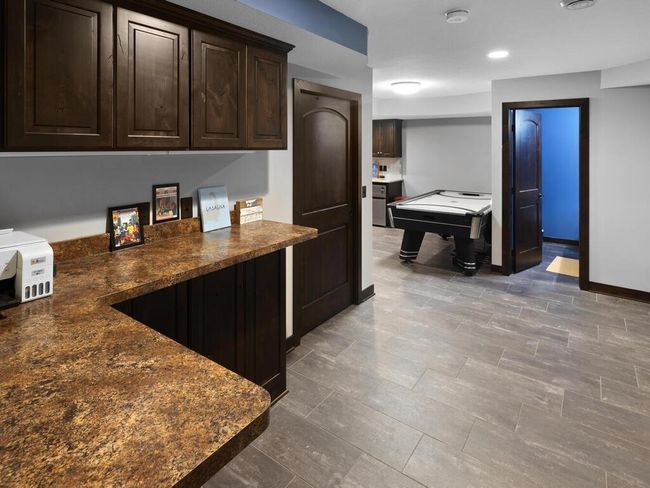 Craft area in LL with nice counter space and cabinets to store your stuff | Image 36