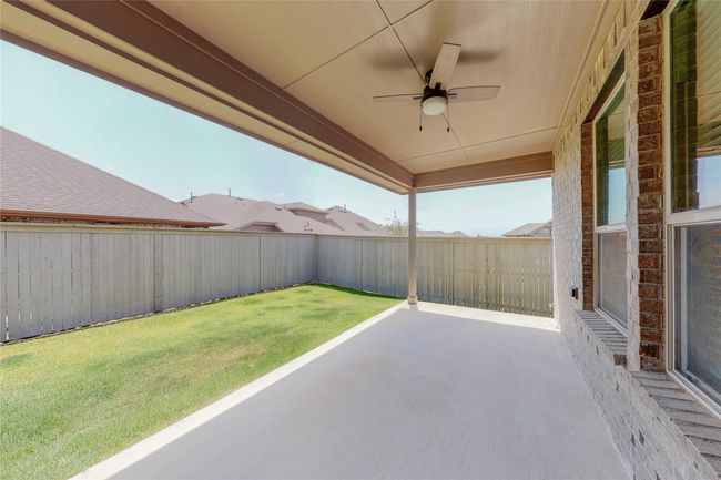 View of yard with ceiling fan and a patio | Image 28