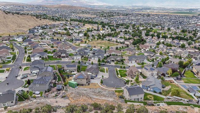 Aerial view of property and surrounding area with nearby suburban area and a mountain backdrop | Image 6
