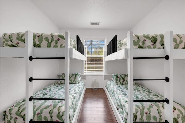 Bedroom with built in bunk beds a closet and wood finished floors | Image 21