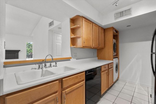 Alternate kitchen view showing generous counter space | Image 12