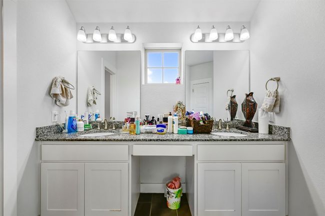 Bathroom featuring double vanity and tile patterned flooring | Image 23