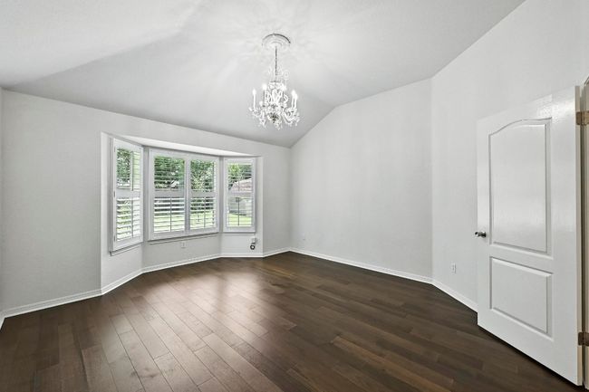 Primary bedroom has vaulted ceilings. | Image 14