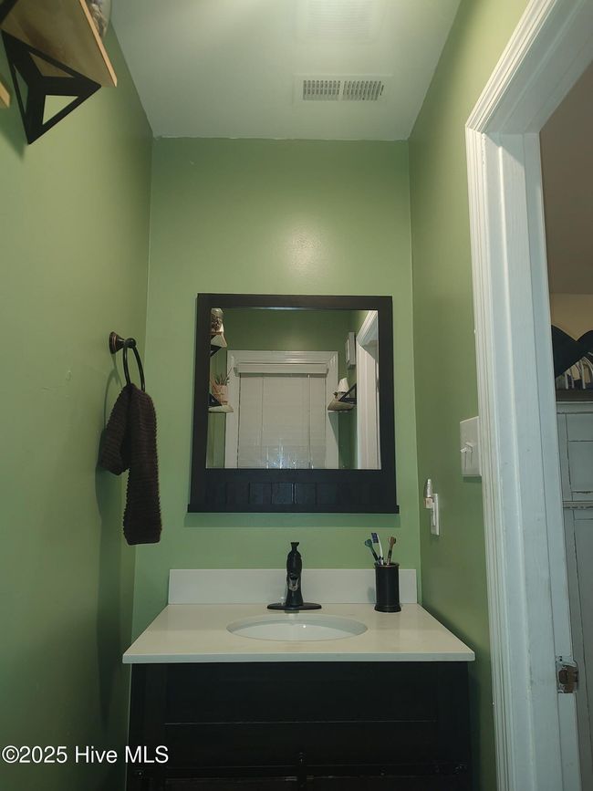 Owners' suite half-bathroom | Image 12