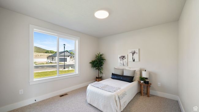 Carpeted bedroom featuring baseboards | Image 15