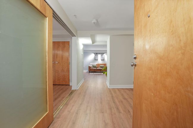 View into Unit from back private entry door, unique Unit with 2 entry access doors and ONLY unit with the Mezzanine location and view | Image 26