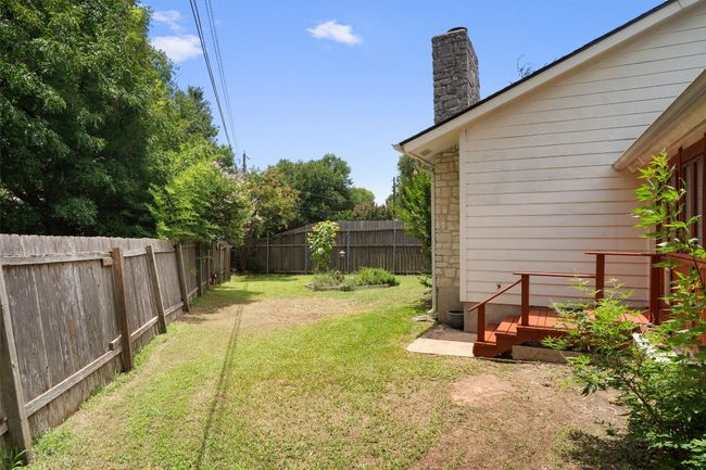 View of fenced backyard | Image 30