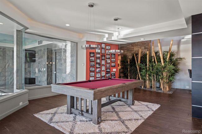Rec room with dark wood finished floors, pool table, and recessed lighting | Image 23