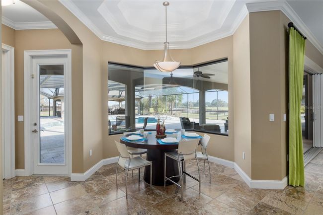 Breakfast nook with seamless bay window overlooking pool area | Image 44