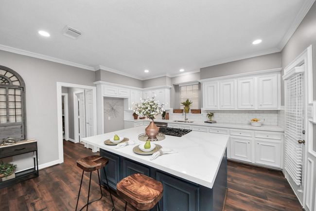 Love the vinyl plank flooring and crown molding. | Image 12