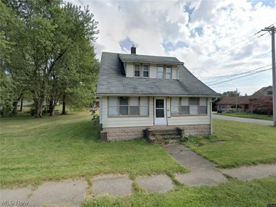 Bungalow featuring a front lawn | Image 1