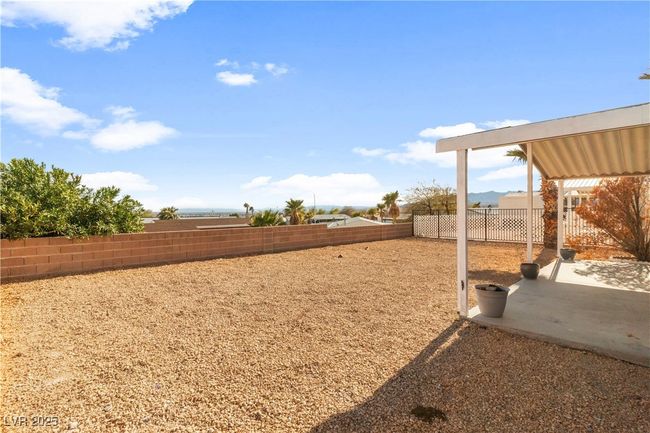 View of yard with a fenced backyard and a patio | Image 36
