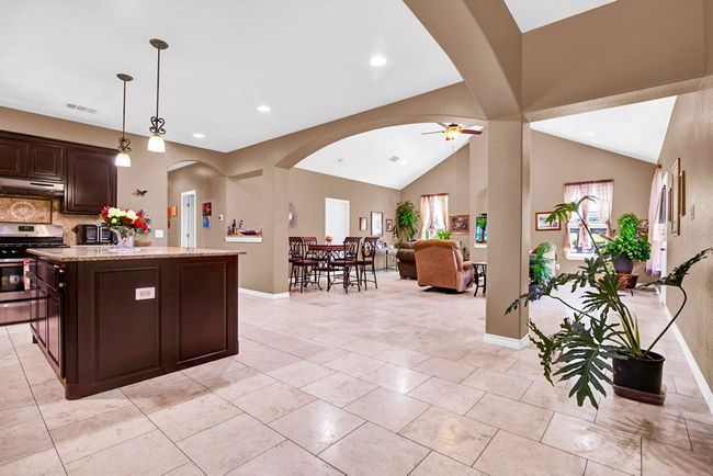 Entering the home: Kitchen to the left, living room and dining in the background | Image 5