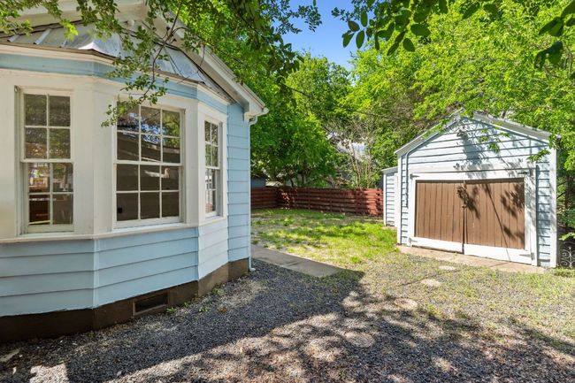 On the right is the 1-car garage. It's in rough shape, but gives lots of options for parking, storage, or getting creative. | Image 14