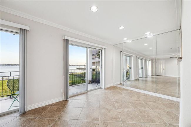 Enjoy the view of Clear Lake while you dine in your spacious dining area | Image 9