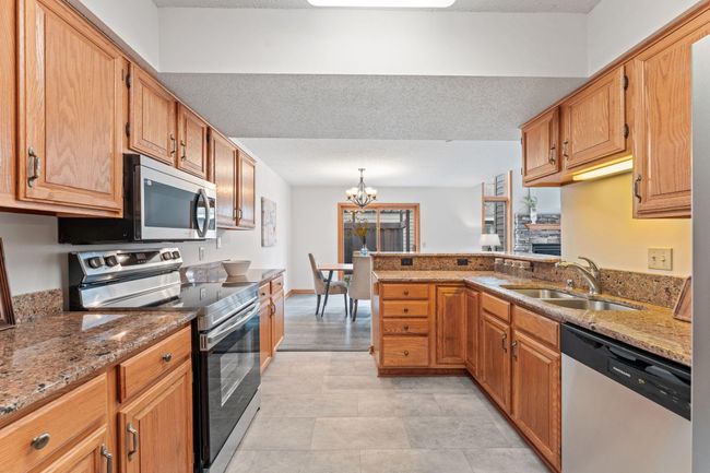 Main level - large kitchen with pantry and stainless appliances | Image 5