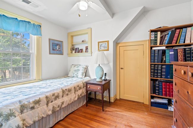 Bedroom featuring wood finished floors and ceiling fan | Image 21