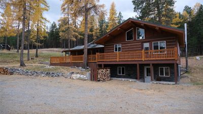 Log cabin featuring a deck | Image 1