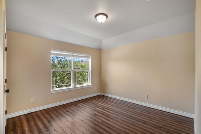 Beautiful front bedroom. Each bedroom has engineered wood floors. | Image 30
