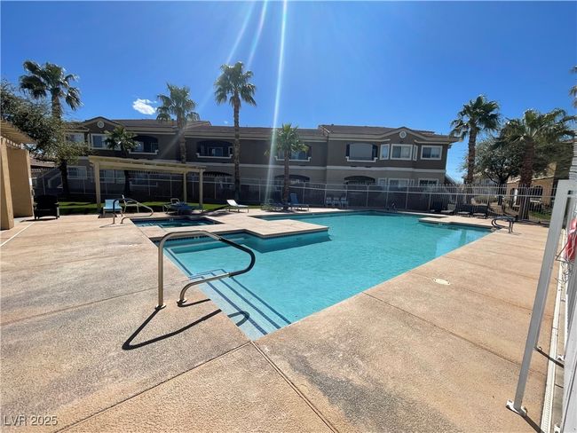 Community pool featuring a patio area and fence | Image 47
