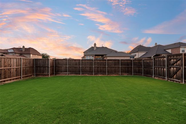 View of fenced backyard | Image 30