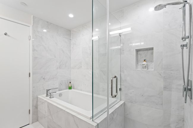 Bathroom with a shower stall, a garden tub, and recessed lighting | Image 17