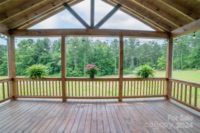 Enjoy views and nature from this fabulous covered front porch | Image 3