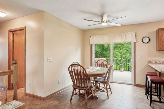 Sliding glass door off the informal dining area walks out to backyard deck. | Image 21