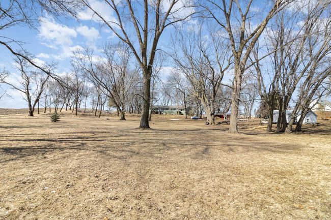 Back lot view with included white shed and chicken coop in front! | Image 26