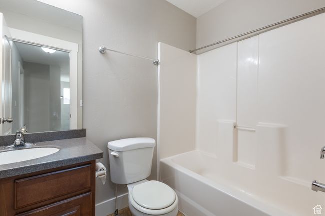 Bathroom featuring vanity and bathing tub / shower combination | Image 23